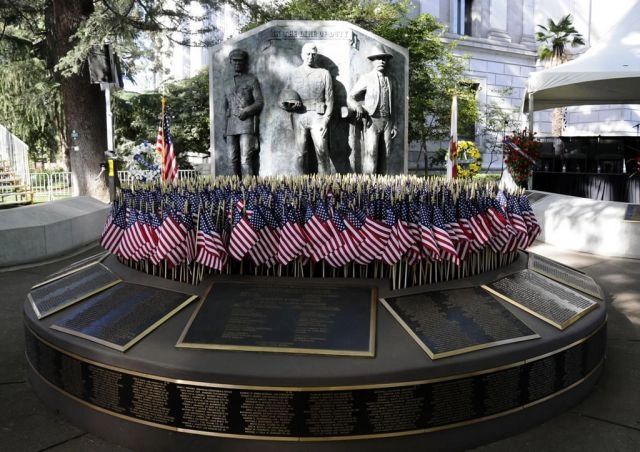 Memorial monument with American flags