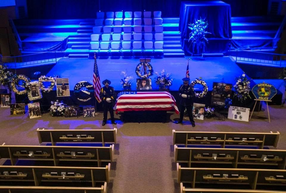 Memorial service with flag-draped casket